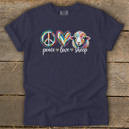 Dark navy t-shirt with "Peace Love Sheep" graphic featuring a peace sign, heart, and colorful sheep.