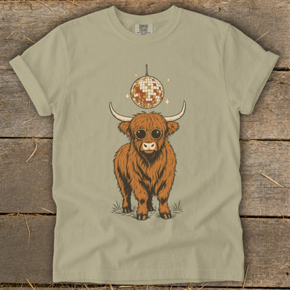 T-shirt with a shaggy Highland cow wearing sunglasses and a disco ball.