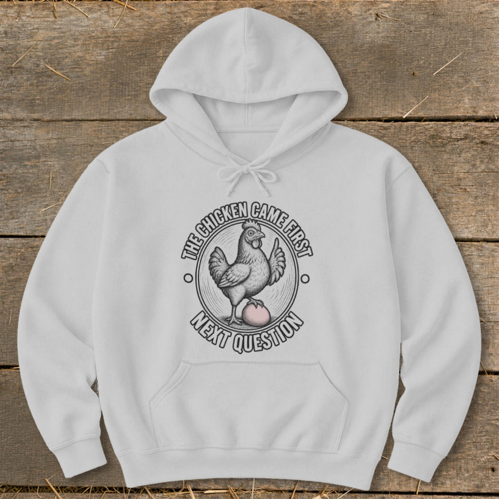 A white hooded sweatshirt featuring a graphic of a chicken standing on an egg, surrounded by text.