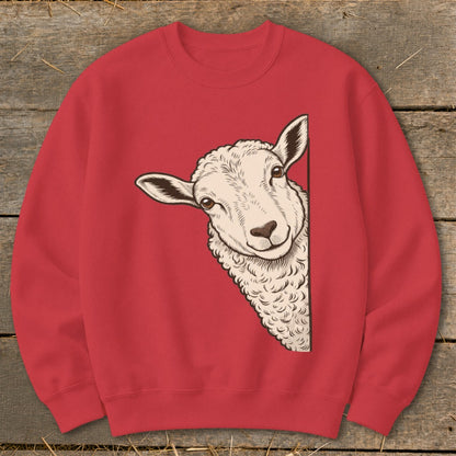 Red sweatshirt with a drawing of a sheep peeking from the side.