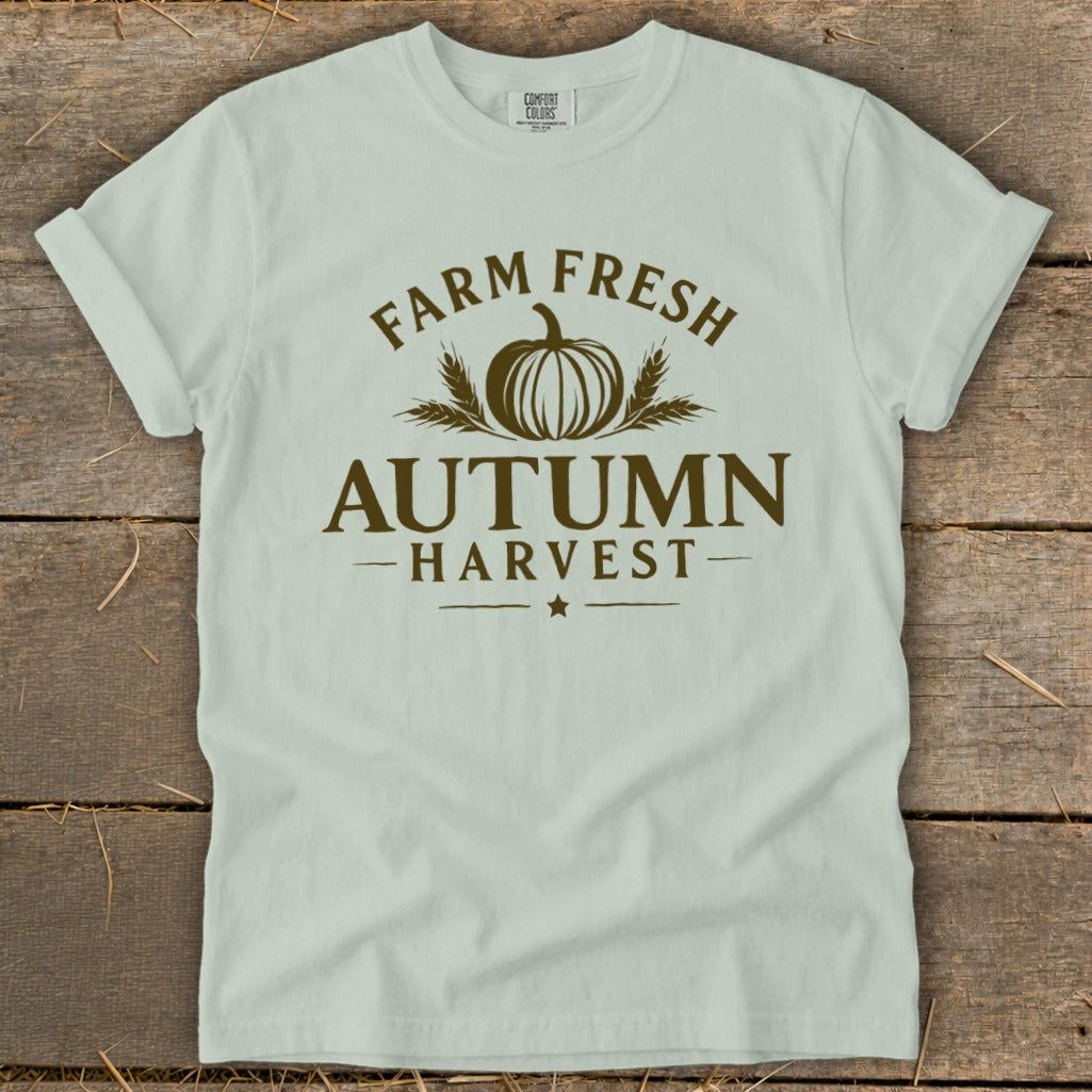 Light green t-shirt with "Farm Fresh Autumn Harvest" text and pumpkin graphic.