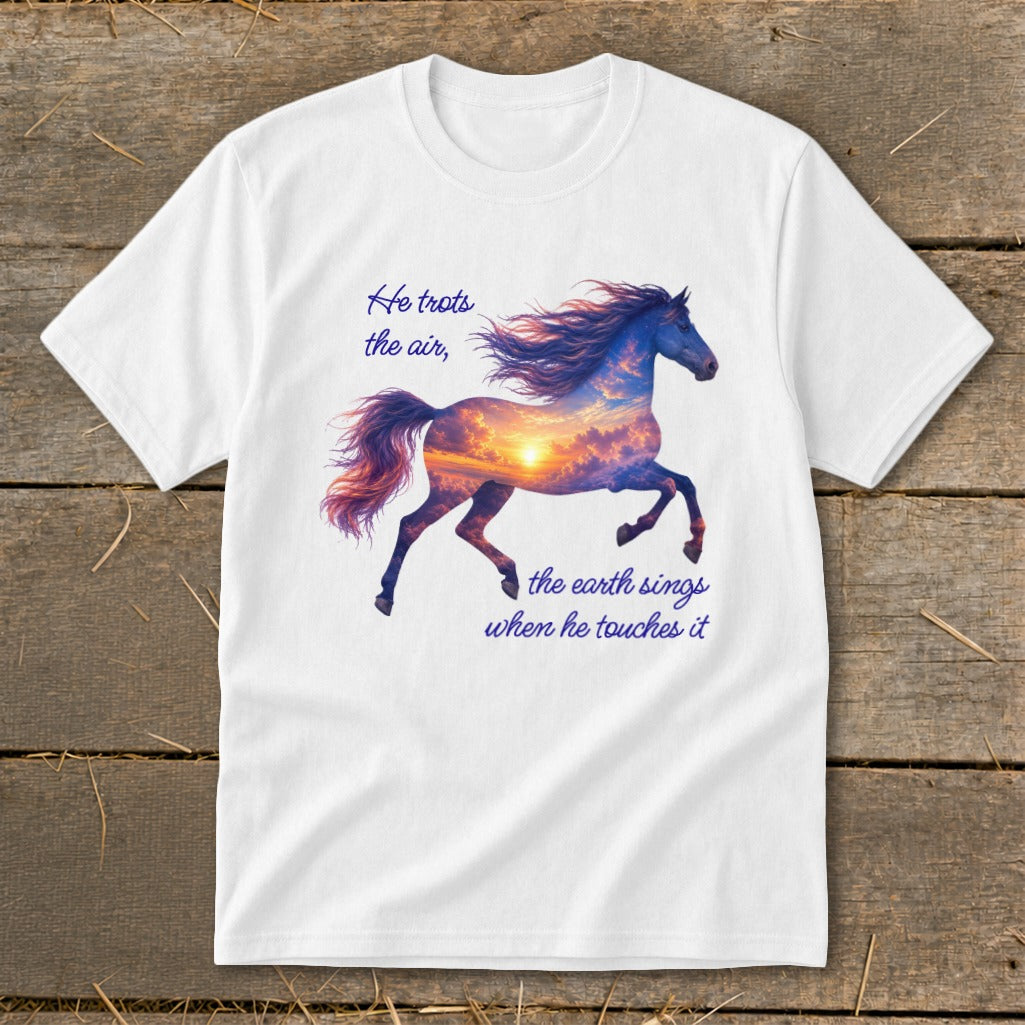 A white t-shirt featuring a galloping horse graphic with a sunset sky silhouette and inspirational text.