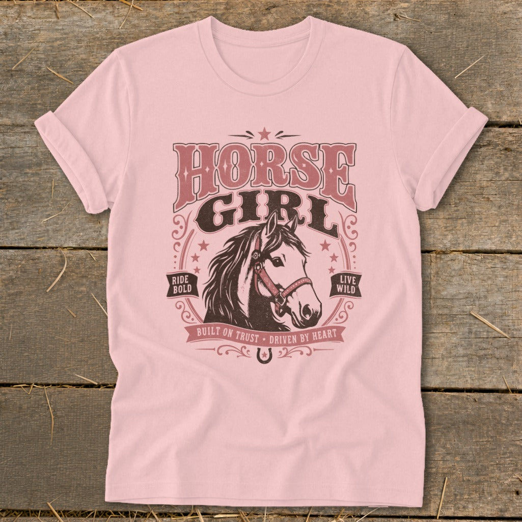 Pink t-shirt with "HORSE GIRL" graphic, horse head, "Ride Bold," and "Live Wild."