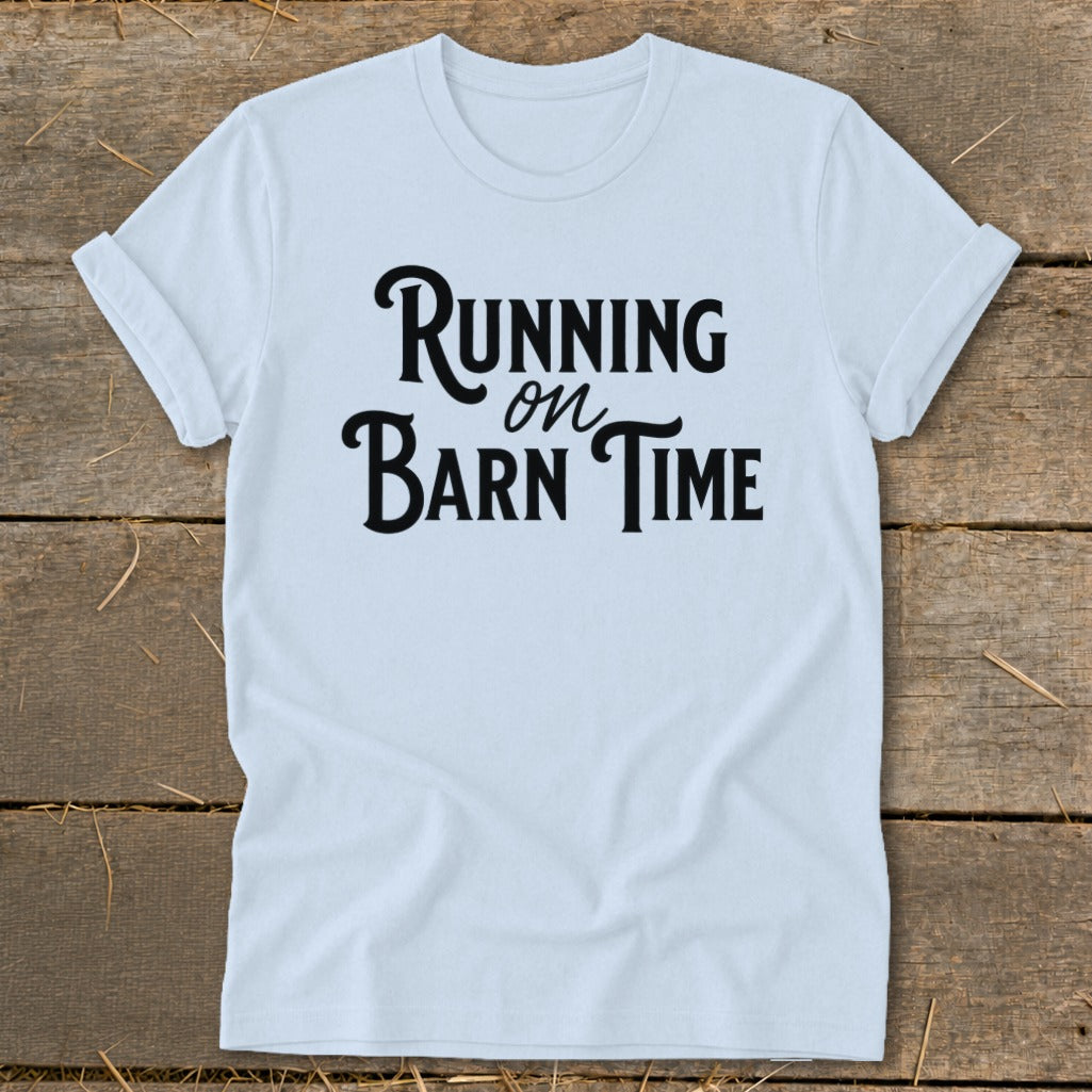 White t-shirt with black text that reads "Running on Barn Time".