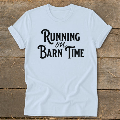 White t-shirt with black text that reads "Running on Barn Time".
