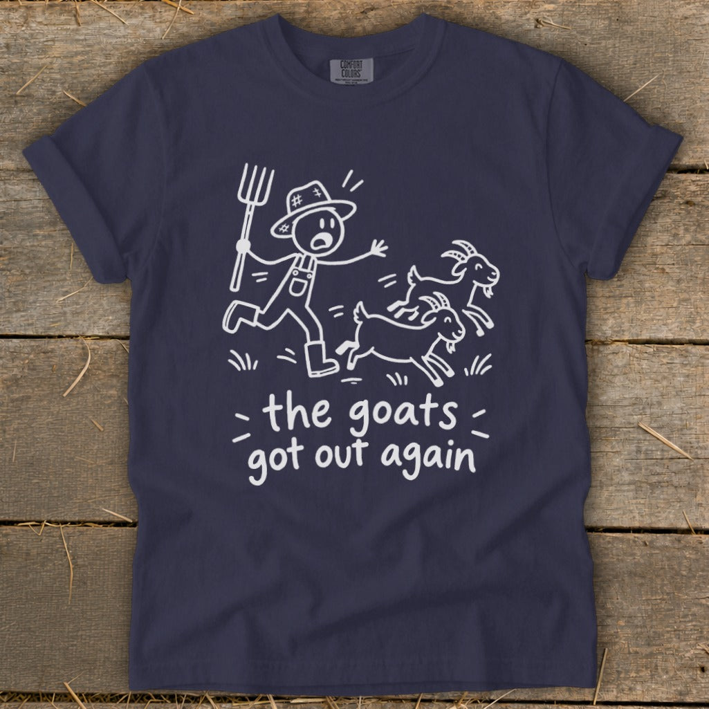 Navy t-shirt with white graphic of a farmer chasing two goats and text "the goats got out again".