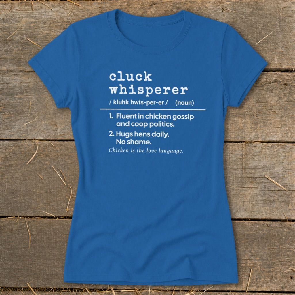 Blue t-shirt with white text defining "cluck whisperer" and its meanings.