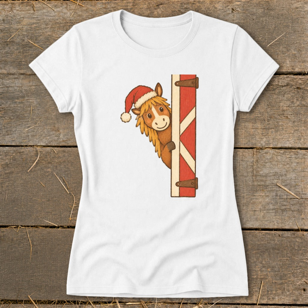 Cartoon horse wearing a Santa hat peeking from behind a red barn door.