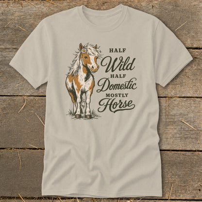 Light beige t-shirt with a brown and white horse illustration and text.