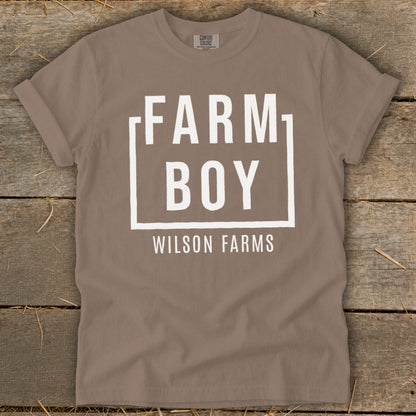 Brown t-shirt with white text that reads "FARM BOY WILSON FARMS".