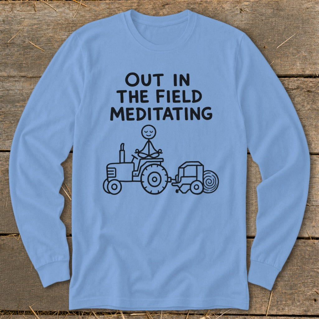 Light blue long-sleeve shirt with "Out in the Field Meditating" text and tractor graphic.