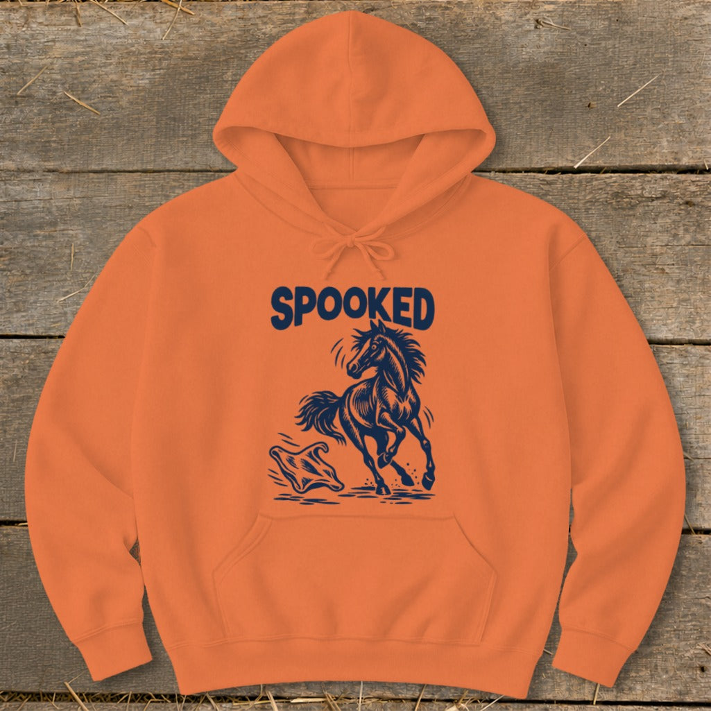 Orange hoodie with dark blue "SPOOKED" text and a startled horse illustration.