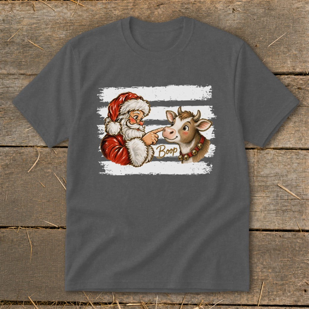 Santa booping a cow's nose with the word "Boop" on a graphic tee.