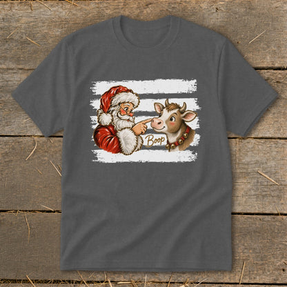 Santa booping a cow's nose with the word "Boop" on a graphic tee.