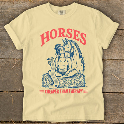 T-shirt graphic: woman with horse, holding a "vet bill," text "HORSES CHEAPER THAN THERAPY".