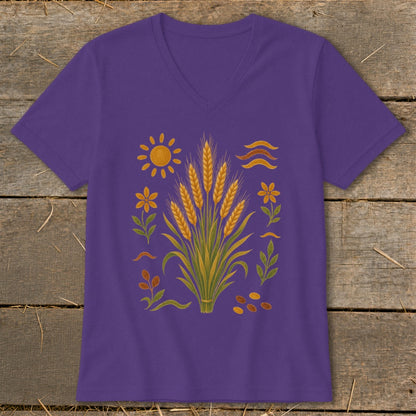 Purple v-neck t-shirt with a graphic of wheat, sun, flowers, and wavy lines.