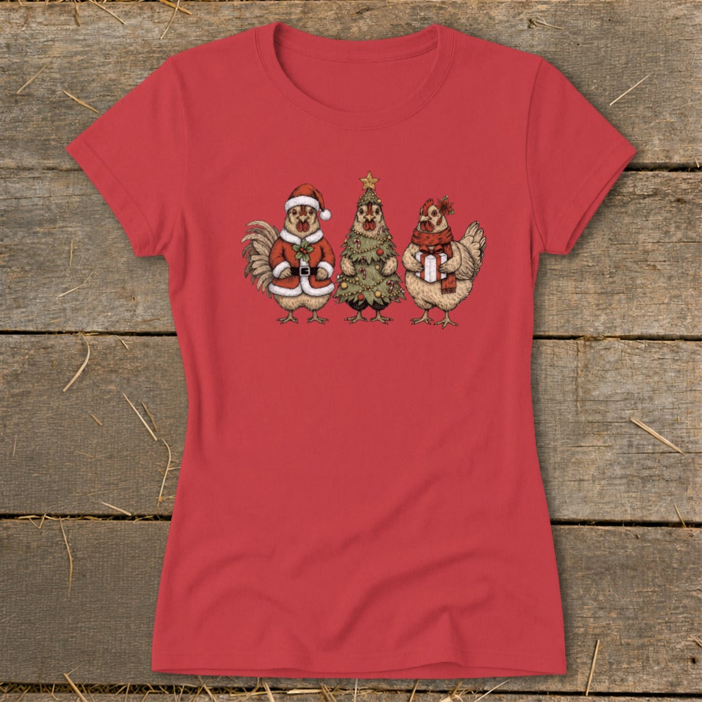 Three cartoon chickens dressed for Christmas on a red t-shirt.