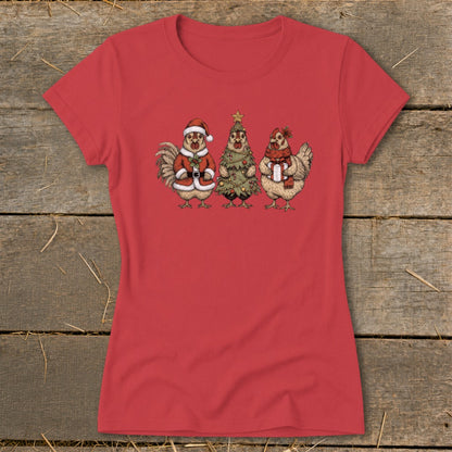 Three cartoon chickens dressed for Christmas on a red t-shirt.