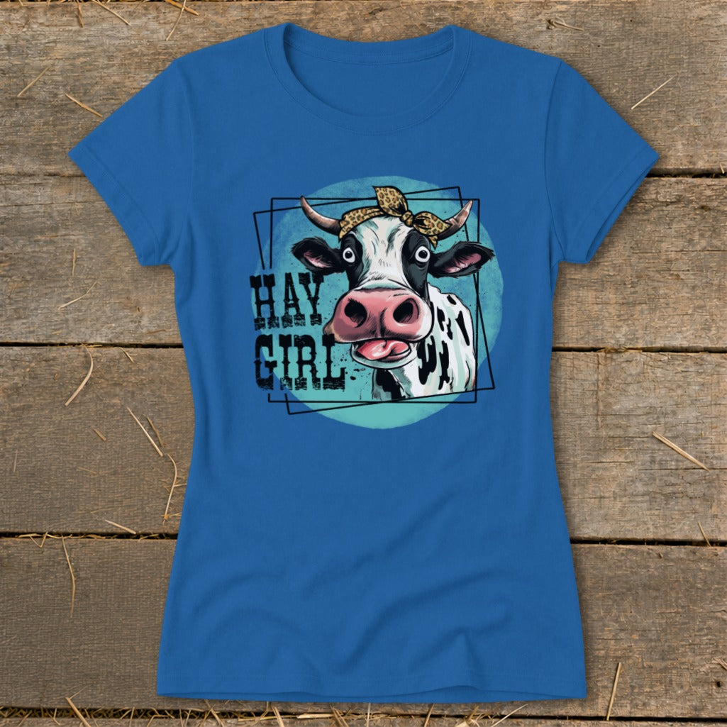 Blue t-shirt with cartoon cow wearing bandana, text "HAY GIRL".
