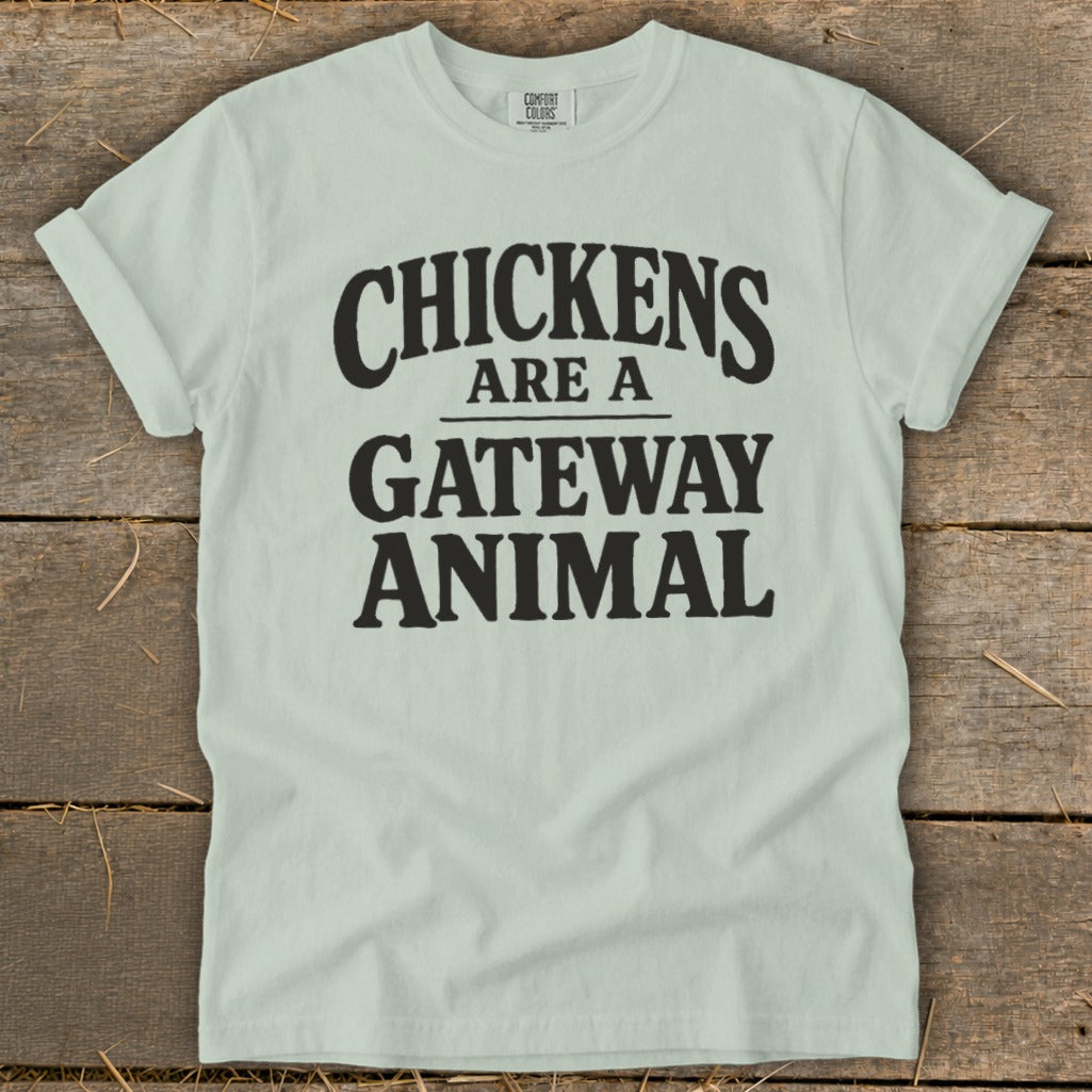 Pale green t-shirt with black text "CHICKENS ARE A GATEWAY ANIMAL".