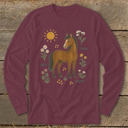 Maroon long-sleeve shirt with a brown horse, sun, and floral illustrations.