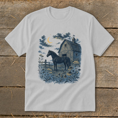 Black horse standing in a field at night with a barn and moon.