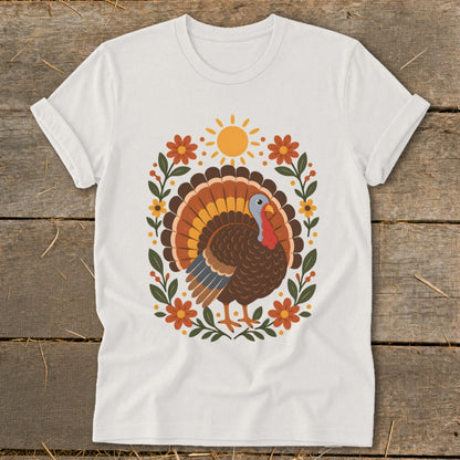 White t-shirt with a Thanksgiving turkey and floral design.