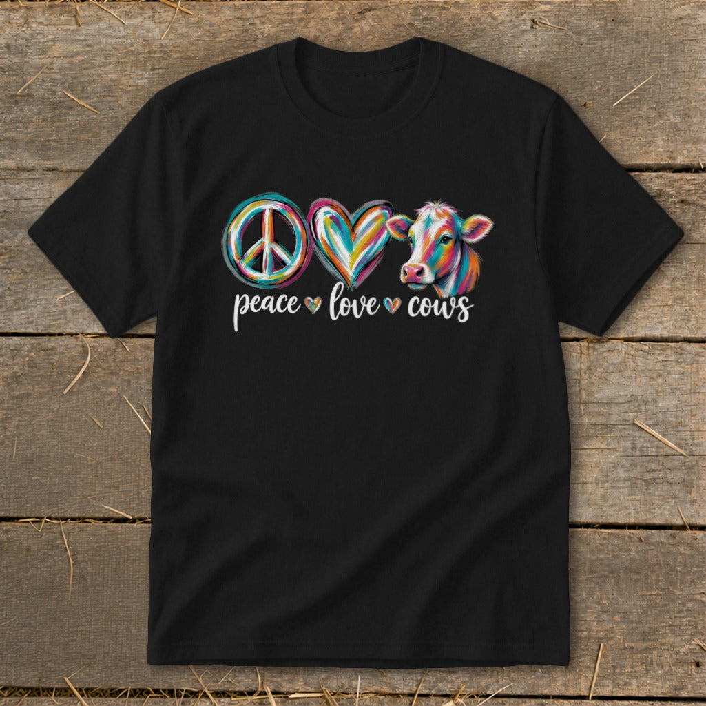 Black t-shirt with peace symbol, heart, and colorful cow graphic and text "peace love cows".