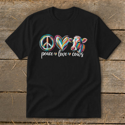 Black t-shirt with peace symbol, heart, and colorful cow graphic and text "peace love cows".