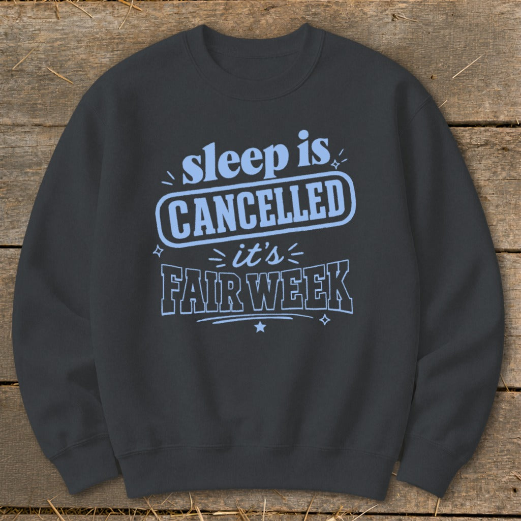 Dark gray sweatshirt with "sleep is CANCELLED it's FAIR WEEK" text.