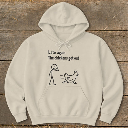 Beige hoodie with "Late again The chickens got out" text and stick figure chasing chicken graphic.