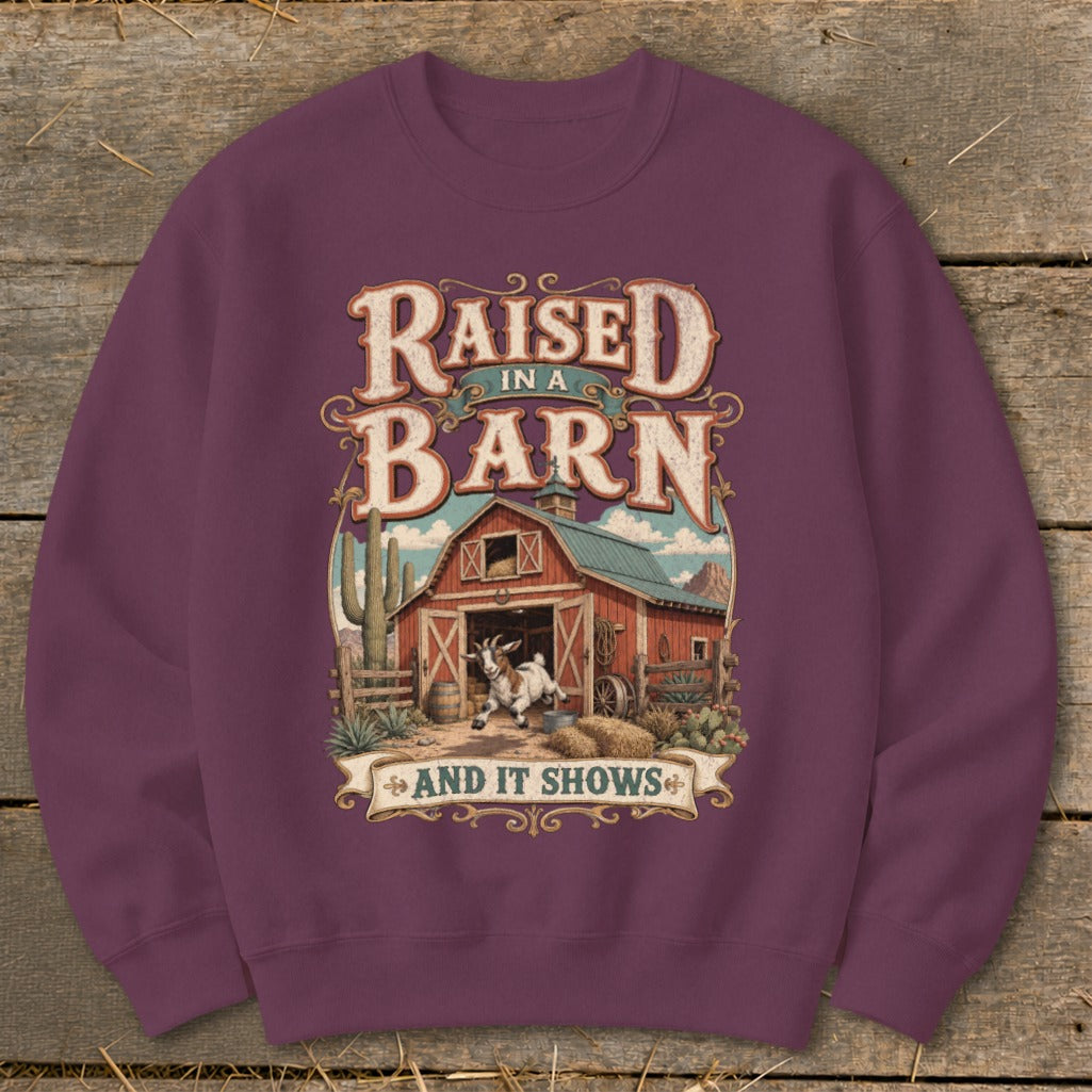 Sweatshirt with "Raised in a Barn and It Shows" text and a goat by a barn.