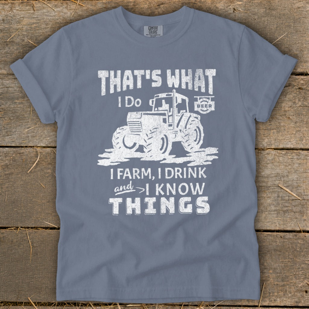 T-shirt with white graphic of tractor and text: That's what I do, I farm, I drink and I know things.
