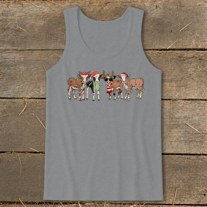 Five cows wearing Santa hats and Christmas lights with festive scarves.