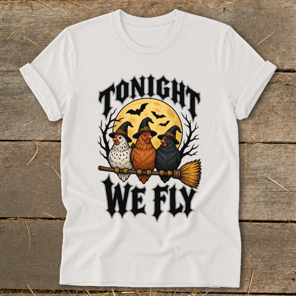 Three chickens wearing witch hats sit on a broomstick with "Tonight We Fly" text.
