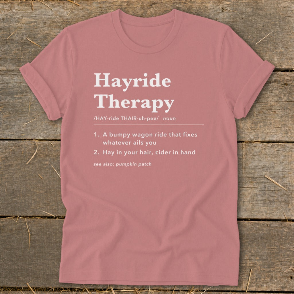 Pink t-shirt with "Hayride Therapy" definition, including "A bumpy wagon ride" and "Hay in your hair".
