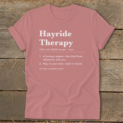 Pink t-shirt with "Hayride Therapy" definition, including "A bumpy wagon ride" and "Hay in your hair".