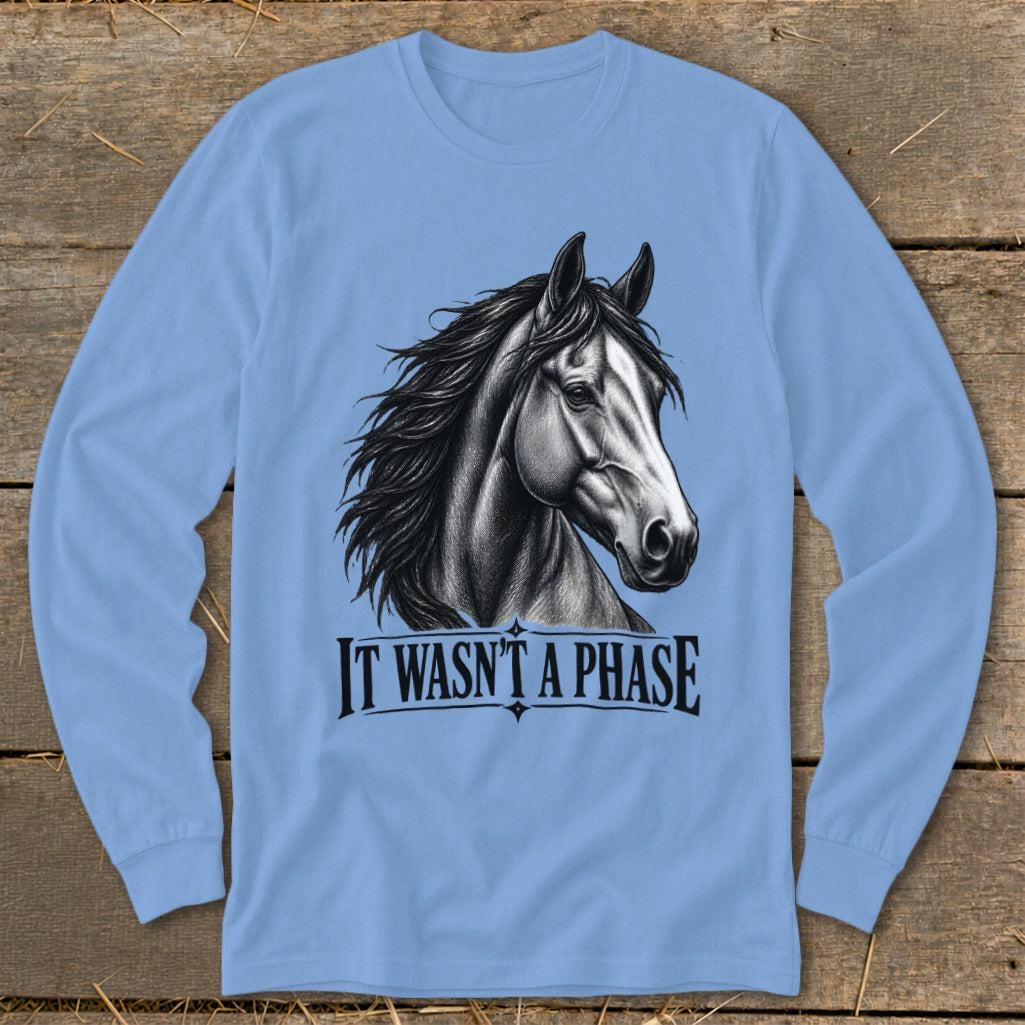 Light blue long-sleeve shirt with horse graphic and text "IT WASN'T A PHASE".