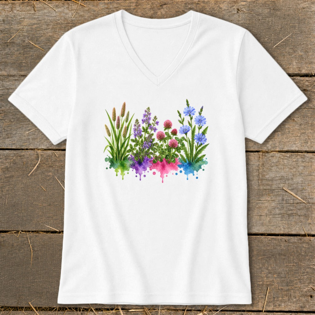 A white V-neck t-shirt featuring a colorful watercolor graphic of wildflowers over matching paint splatters.