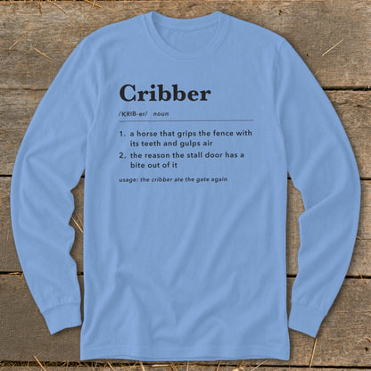 A light blue long-sleeve t-shirt with a humorous dictionary definition of cribber printed on the chest.