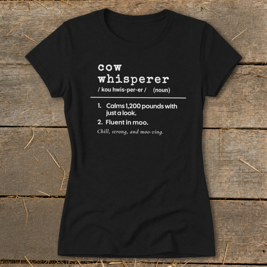Black t-shirt with "Cow Whisperer" definition and humorous descriptions.