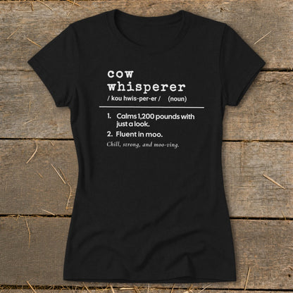 Black t-shirt with "Cow Whisperer" definition and humorous descriptions.