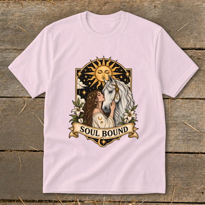 Woman embracing white horse with sun and stars, text "Soul Bound".