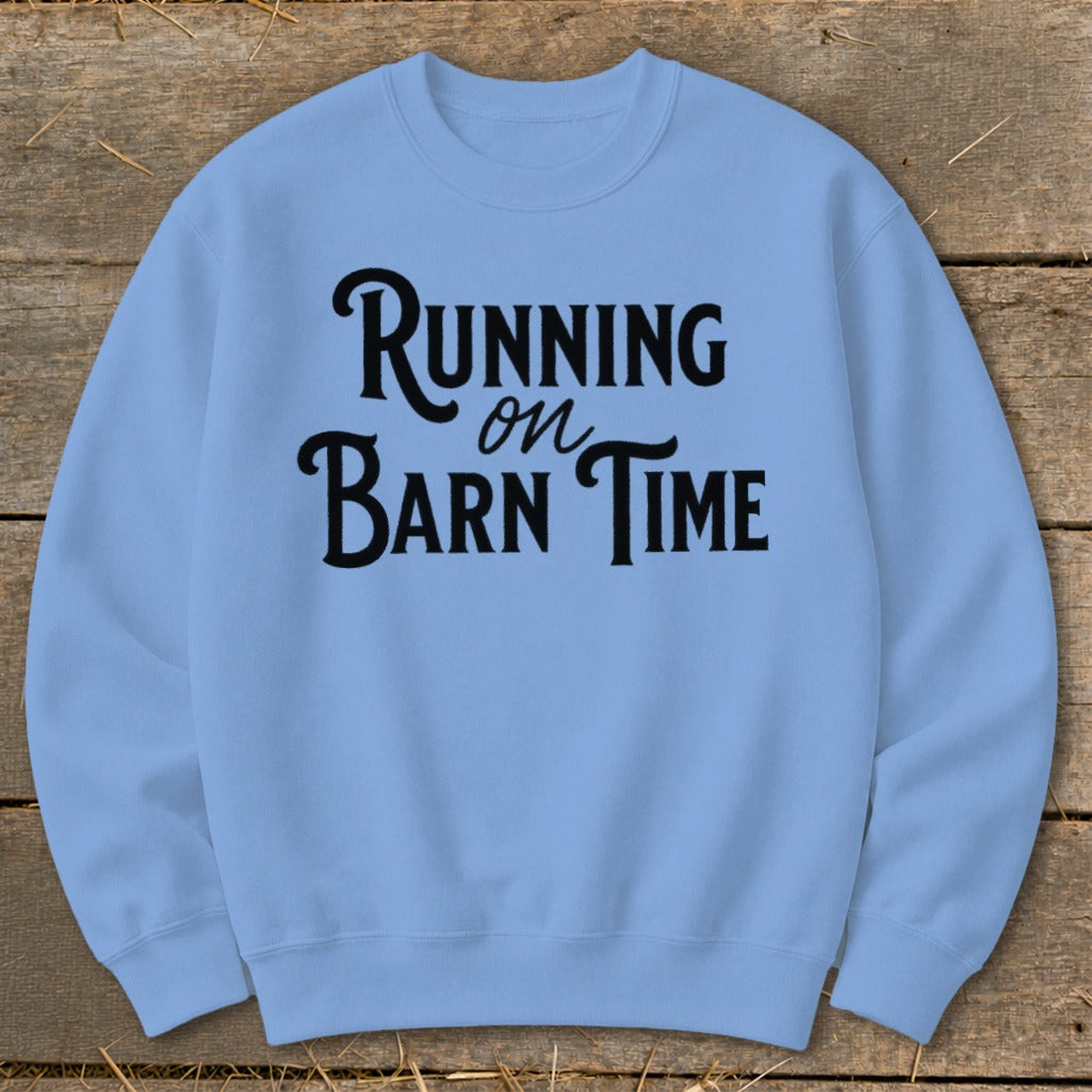 Light blue sweatshirt with black text reading "Running on Barn Time".