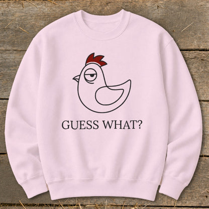 Pink sweatshirt with a line drawing of a chicken and "GUESS WHAT?" text.