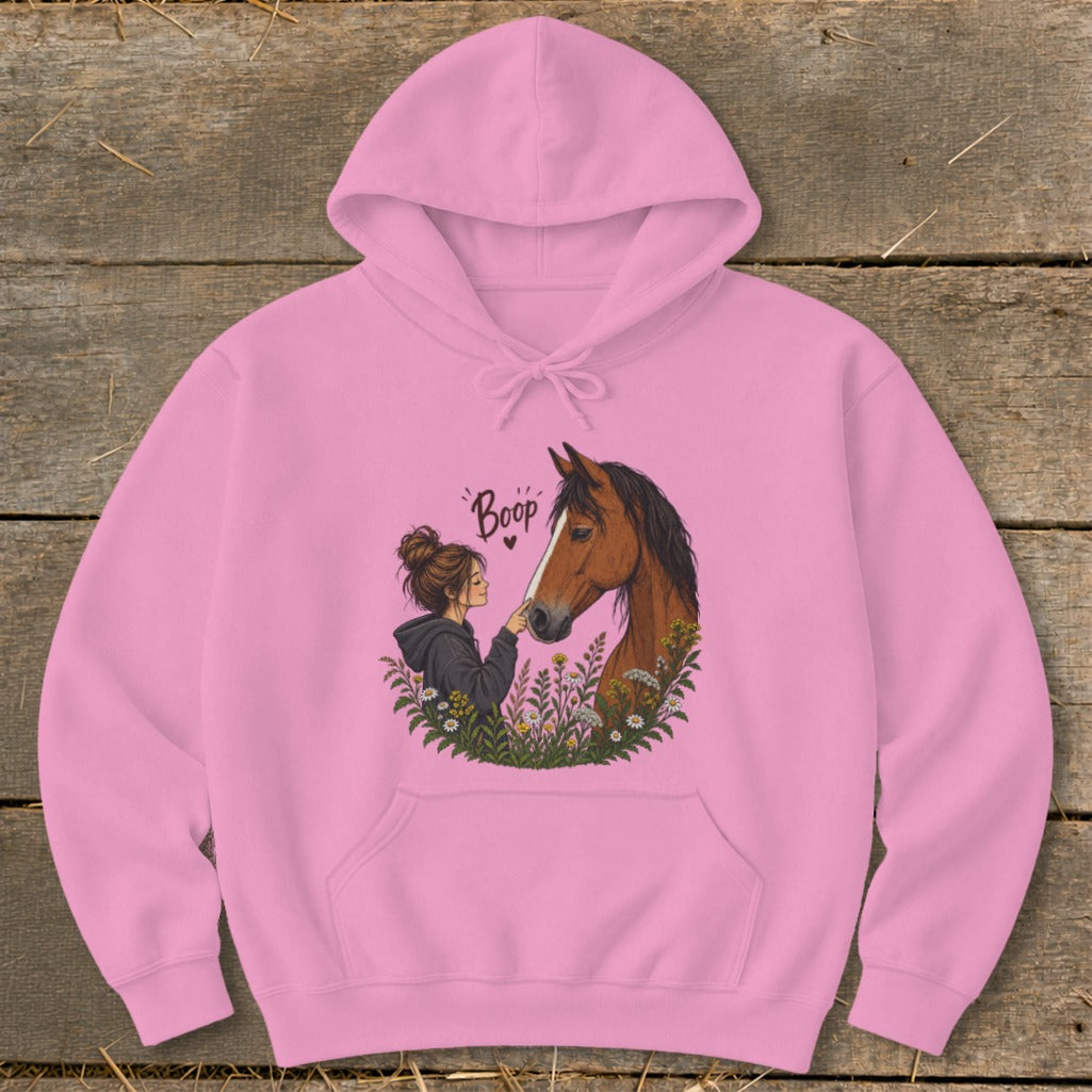 Pink hoodie with artwork of a girl and horse with the word "Boop".