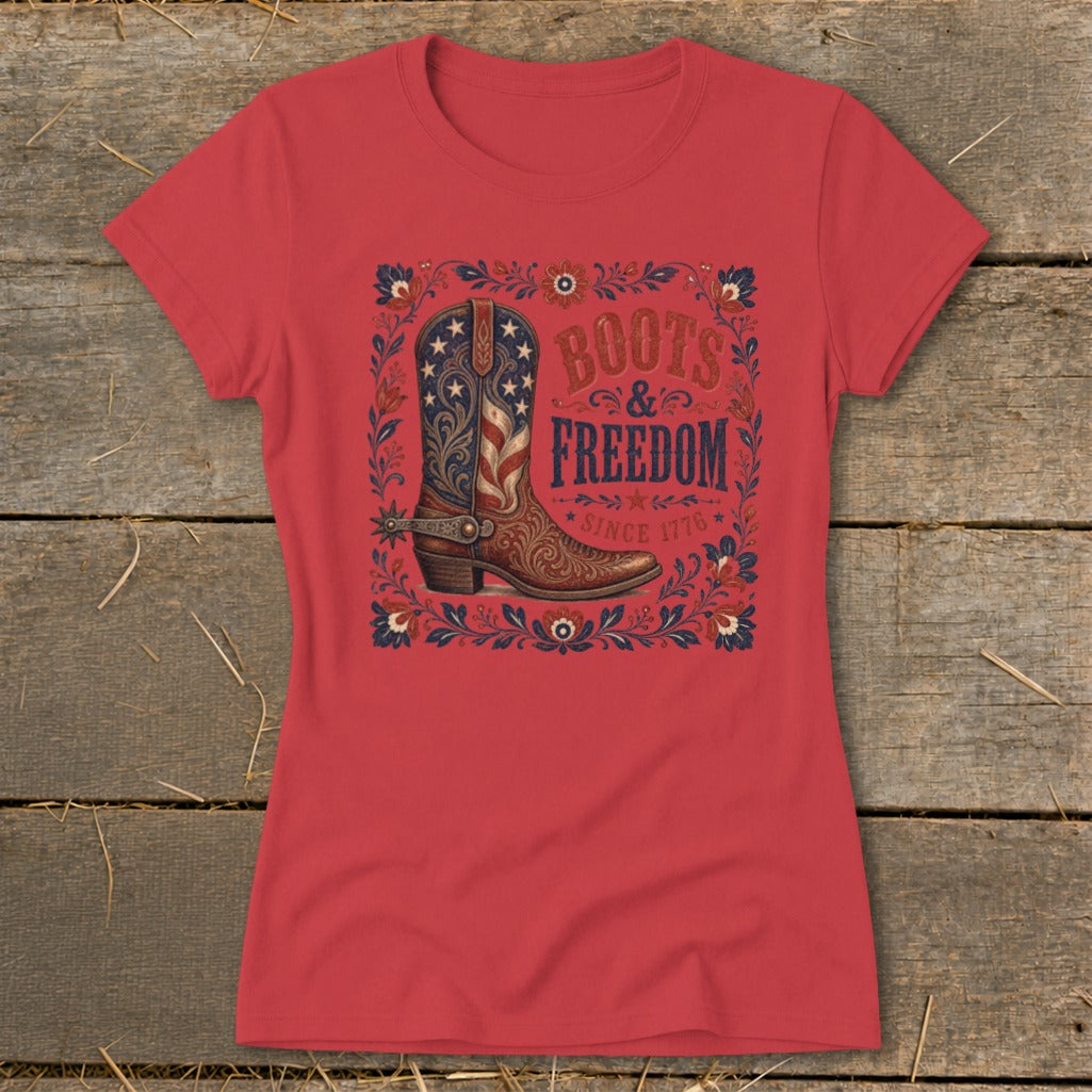 Red t-shirt with cowboy boot graphic and text "Boots & Freedom Since 1776".