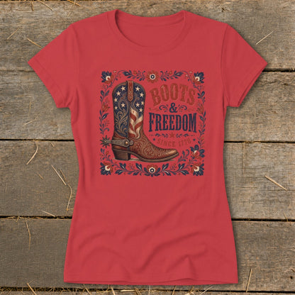 Red t-shirt with cowboy boot graphic and text "Boots & Freedom Since 1776".