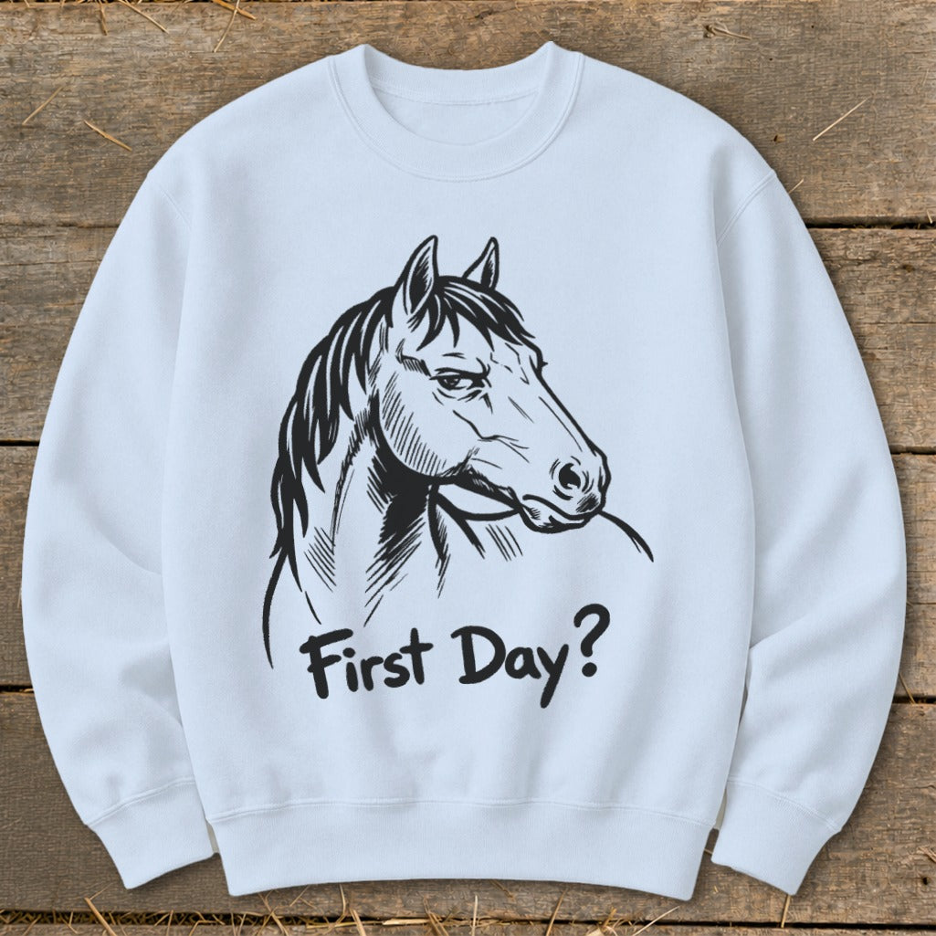 White sweatshirt with a black line drawing of a horse's head and the text "First Day?".