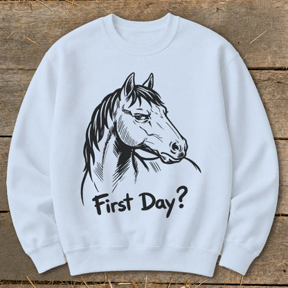 White sweatshirt with a black line drawing of a horse's head and the text "First Day?".